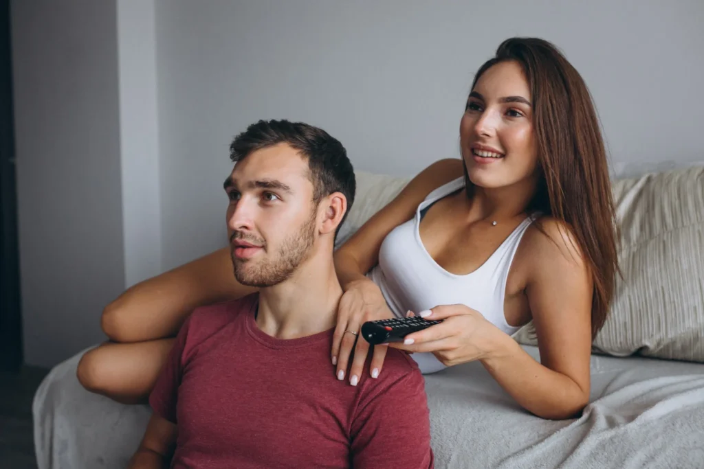 A couple enjoying Montreal Best IPTV in a modern living room